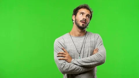 Young man on chroma green screen tired and bored Stock Footage 97706588