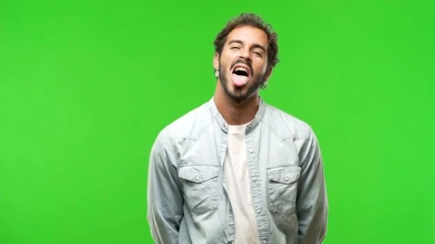 Young man on chroma green screen funnny and friendly Stock Footage 97707737