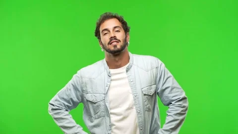 Young man on chroma green screen with hands on hips Stock-Footage 97708149