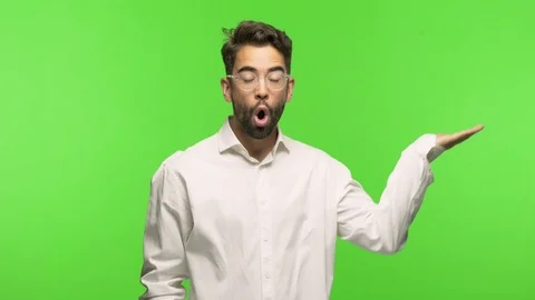 Young man on chroma holding something with palm hand Stock Footage 97589195