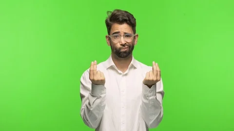 Young man on chroma making a gesture of need Stock Footage 97589027