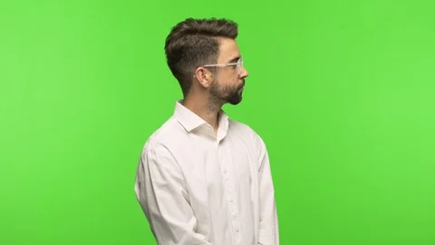 Young man on chroma on the side looking Stock Footage 97589314