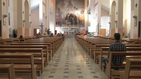 Young man in a church Stock Footage 89974008