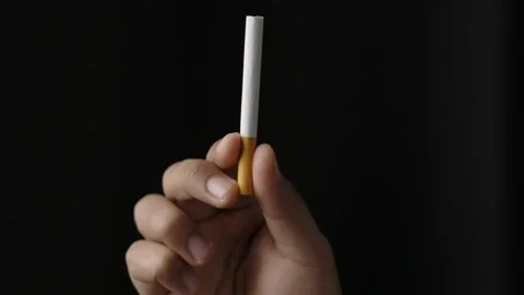 A young man with a cigarette He is going to smoke. Close up hand man showing  Stock-Footage 152765324