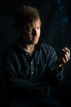 Young man with Cigarette Stock Photos