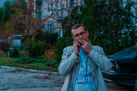 Young man with a cigarette. Stock Photos