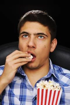 Young man at cinema Stock Photos