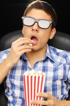 Young man at cinema Stock Photos