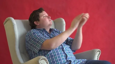 Young Man clapping and smiling, red background Stock Footage 82381765