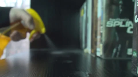 Young Man Cleaning A Shelf Side-Shot Stock Footage 34045344