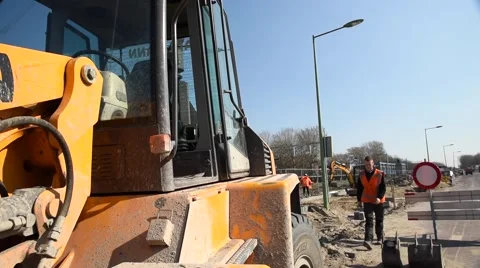 Young man climbing in to excavator Video stock 62197973