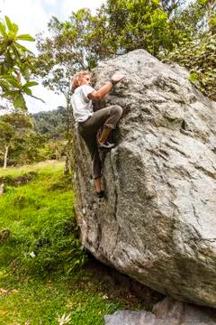 Young man climbing Stock Photos