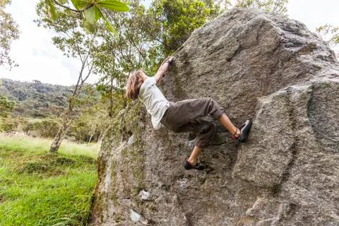 Young man climbing Stock Photos