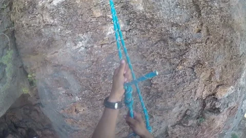 Young man climbing on a rock in a Cave. Climbing equipment. Video stock 139465829