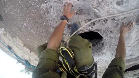 Young man climbing on a rock in a Cave. Climbing equipment. Stock Footage 139467005