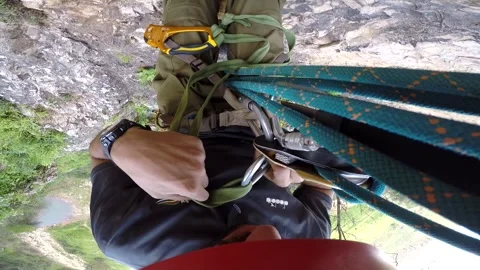Young man climbing on a rock in a Cave. Climbing equipment. Stock Footage 139467415