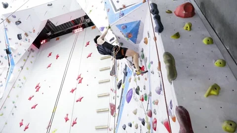 Young Man Climbing A Rock Wall Stock Footage 236306444