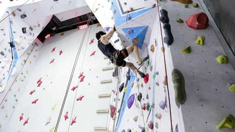 Young Man Climbing A Rock Wall Stock Footage 236306907