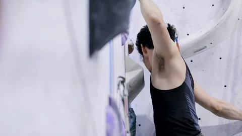 Young Man Climbing A Rock Wall Stock Footage 236307318