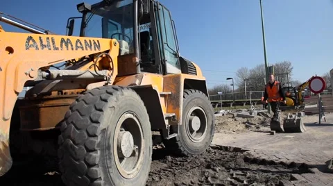 Young man climbs in the excavator Video stock 62197974