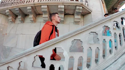 A young man climbs the stairs at the Topkapi Palace in Istanbul, Turkey Stock Footage 290095974