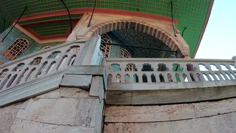 A young man climbs the stairs at the Topkapi Palace in Istanbul, Turkey Stock Footage 290096147