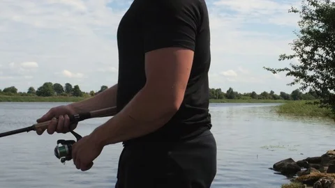 Young man close up shot during fishing in sunny day Video stock 84004482