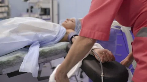 Young man with closed eyes lying on the operating table Stock Footage 82506409