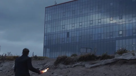 Young man clutching in hand and throwing burning Molotov cocktail bottle Video stock 74364053