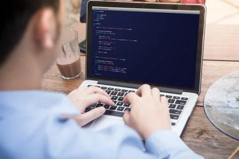 Young man coding and programming for web development and web design concept  库存照片