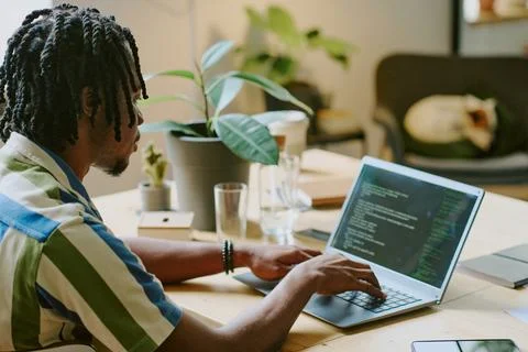 Young Man Coding In Modern Office Stock Photos