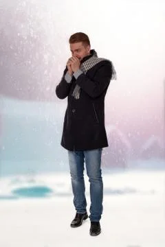 Young man with cold hands Stock Photos