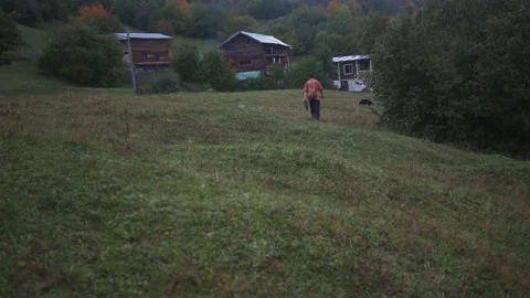 A young man comes to his dacha after a long walk in the forest Stock-Footage 194046124