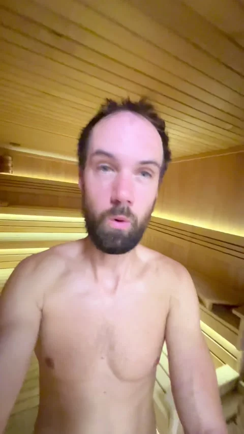 Young man comes out of the steam room, sauna Stock Footage 237761142
