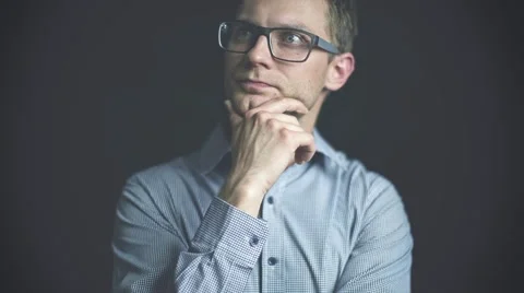 Young man coming up with an idea or solution over a dark background. 動画素材 40803537