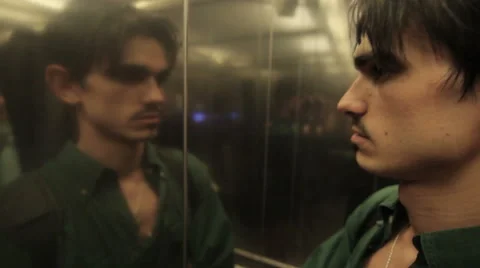 A young man coming out of the elevator Stock Footage 60239933