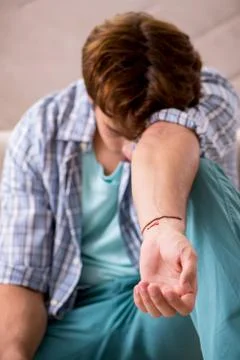 Young man committing suicide with razor blade Stock Photos