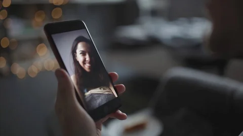 A young man communicates with his girlfriend on video Stock Footage 103150472