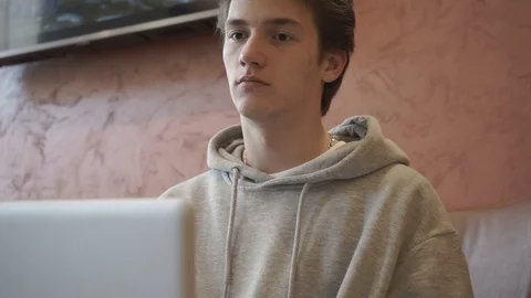 Young man communicates in a messenger Stock Footage 127752196