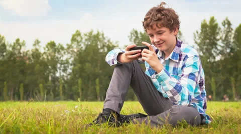 Young man communicates on the smartphone Stock Footage 35849702