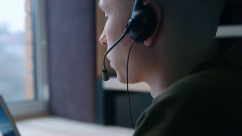 Young man communicates on video chat. Home office concept. Face close-up, side Stock Footage 103862101