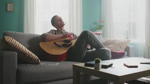 Young Man Is Composing Melody Playing Guitar Stock-Footage 149264369