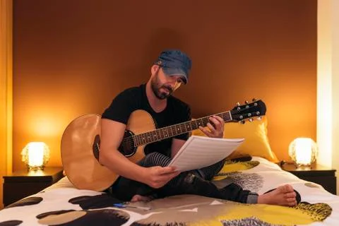 Young man composing music. Stock Photos