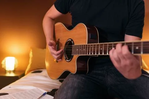 Young man composing music. Stock Photos
