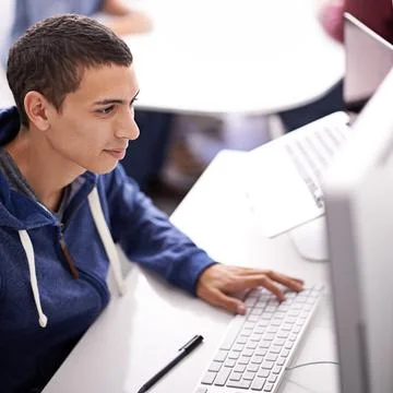 Young man, computer and typing at office desk for web development, programming 스톡 사진