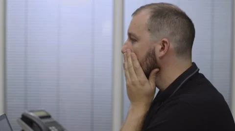 Young man at a computer looking stressed and disappointed Video stock 68614918