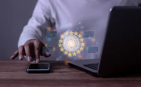 Young man with computer notebook and smartphone touching to Interconnect, I.. Stock Photos