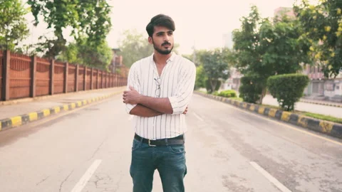 Young man confused standing on empty road making poses Stock Footage 138677467