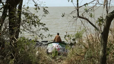 Young man contemplating the Rio de la Plata Stock Footage 219225865