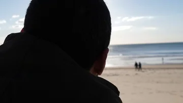 Young man contemplating sunset on the beach Stock Footage 85473125